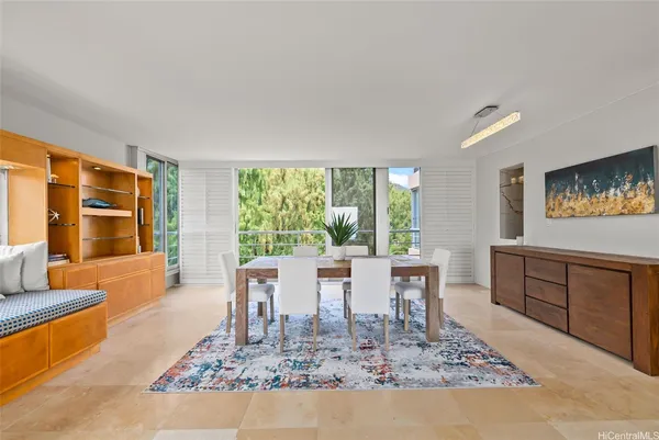 a view of a dining room with furniture window and wooden floor