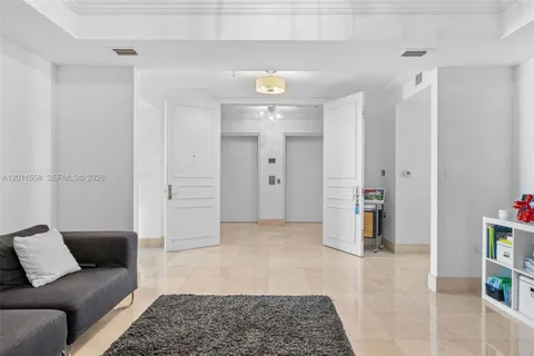 a living room with furniture and a rug