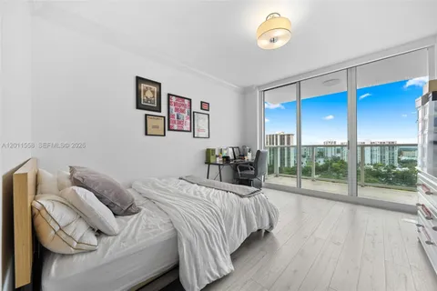 a bed room with a bed and a lamp