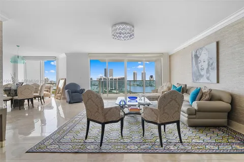 a living room with furniture a rug and a table