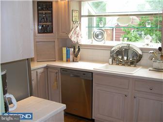 2584 High Road Huntingdon Valley, PA 19006 - Photo 7 of 12 a bathroom with a sink a toilet and a window