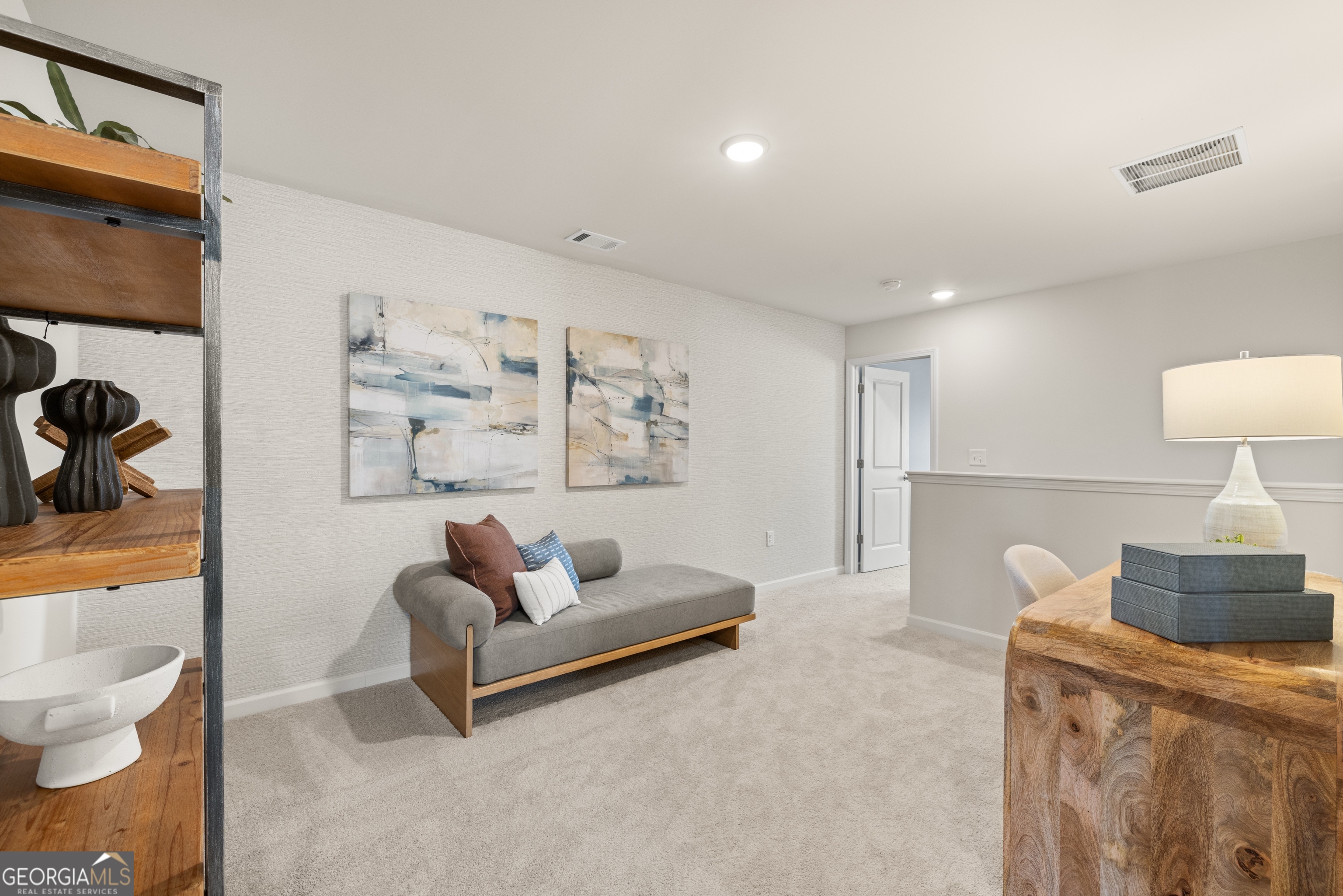 3261 Lake Carlton Road, Unit 24 Loganville, GA 30052 - Photo 19 of 33 a living room with furniture and a lamp