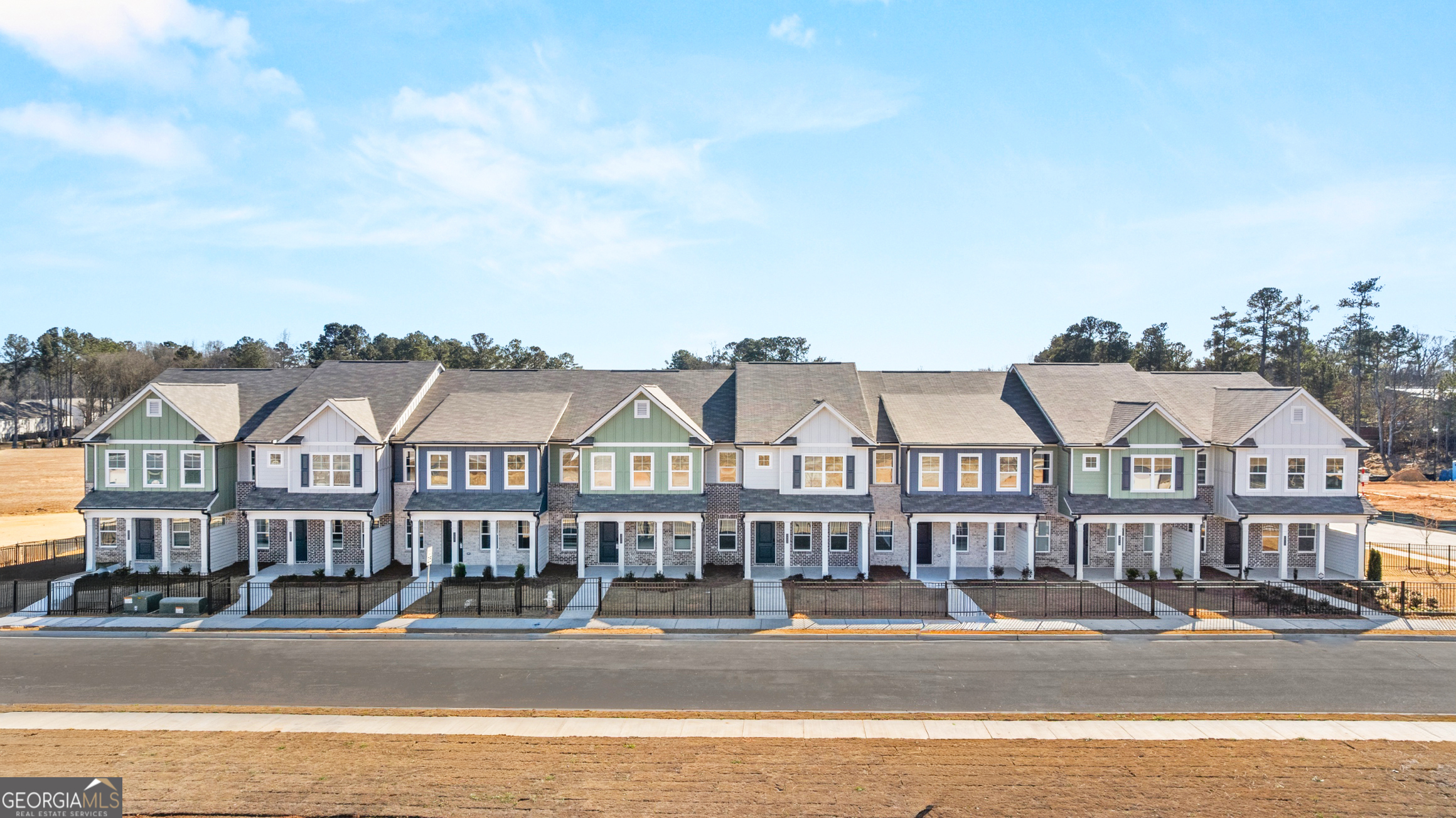 3261 Lake Carlton Road, Unit 24 Loganville, GA 30052 - Photo 2 of 33 a front view of residential houses and street