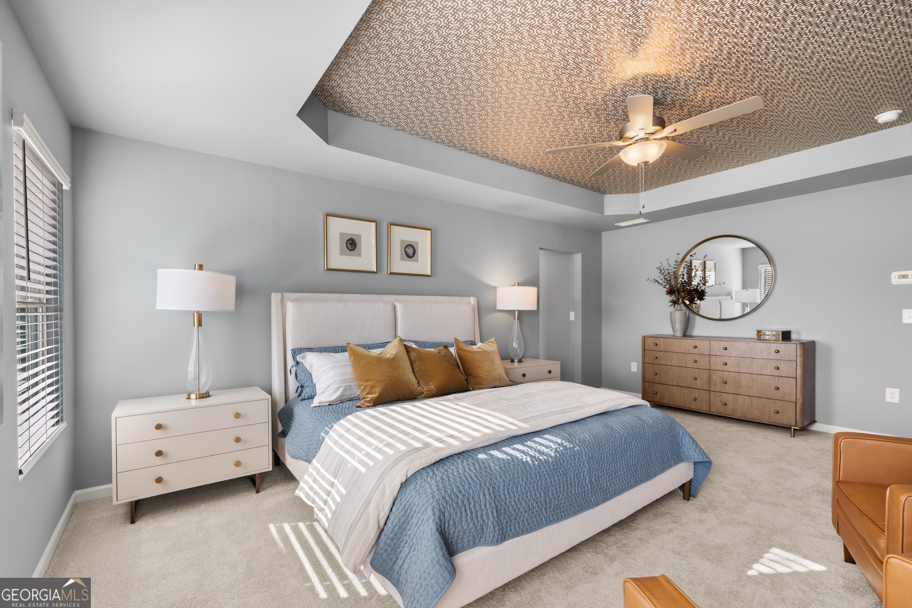 3261 Lake Carlton Road, Unit 24 Loganville, GA 30052 - Photo 24 of 33 a bedroom with bed and a chandelier