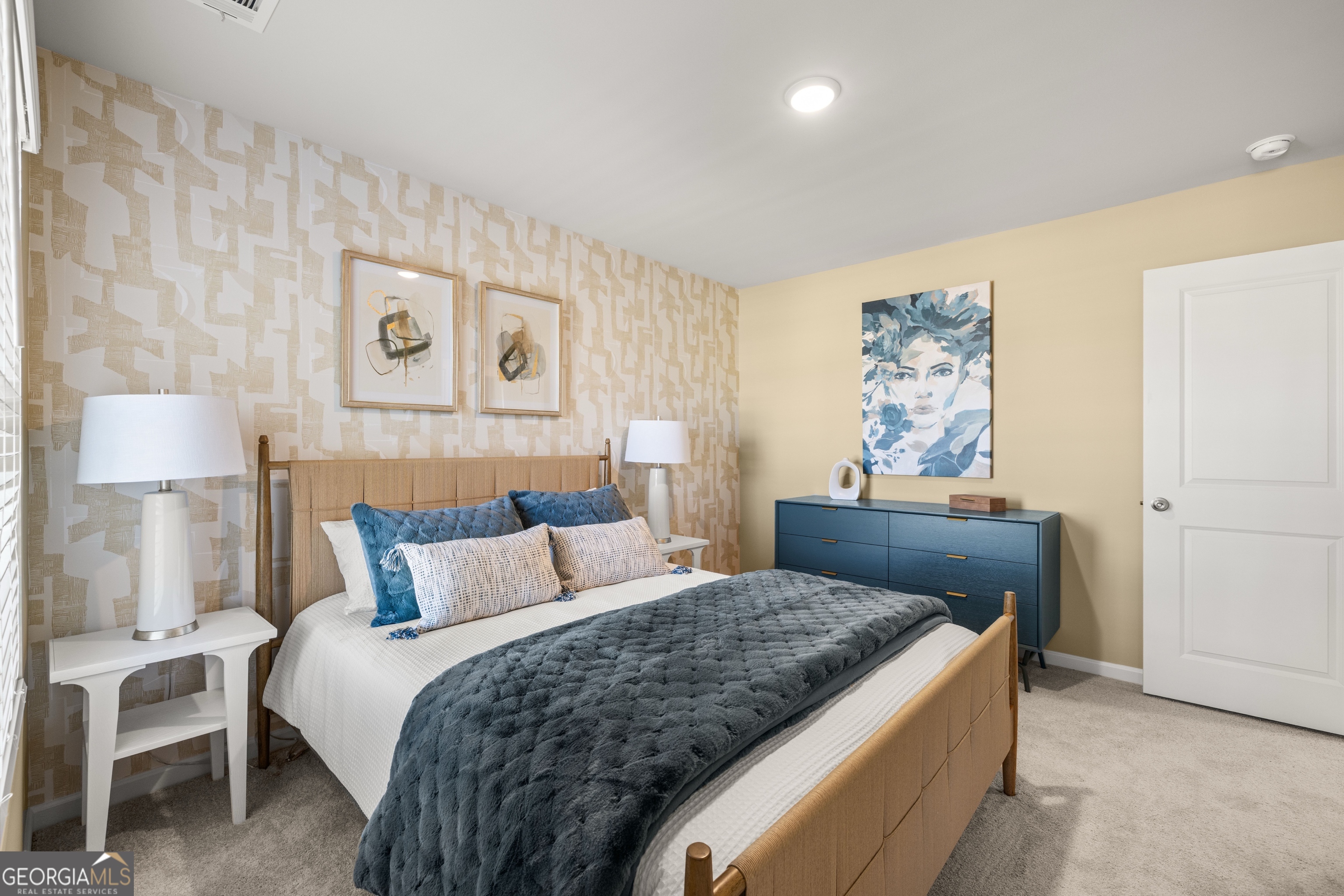 3261 Lake Carlton Road, Unit 24 Loganville, GA 30052 - Photo 29 of 33 a bedroom with a bed and a lamp on table