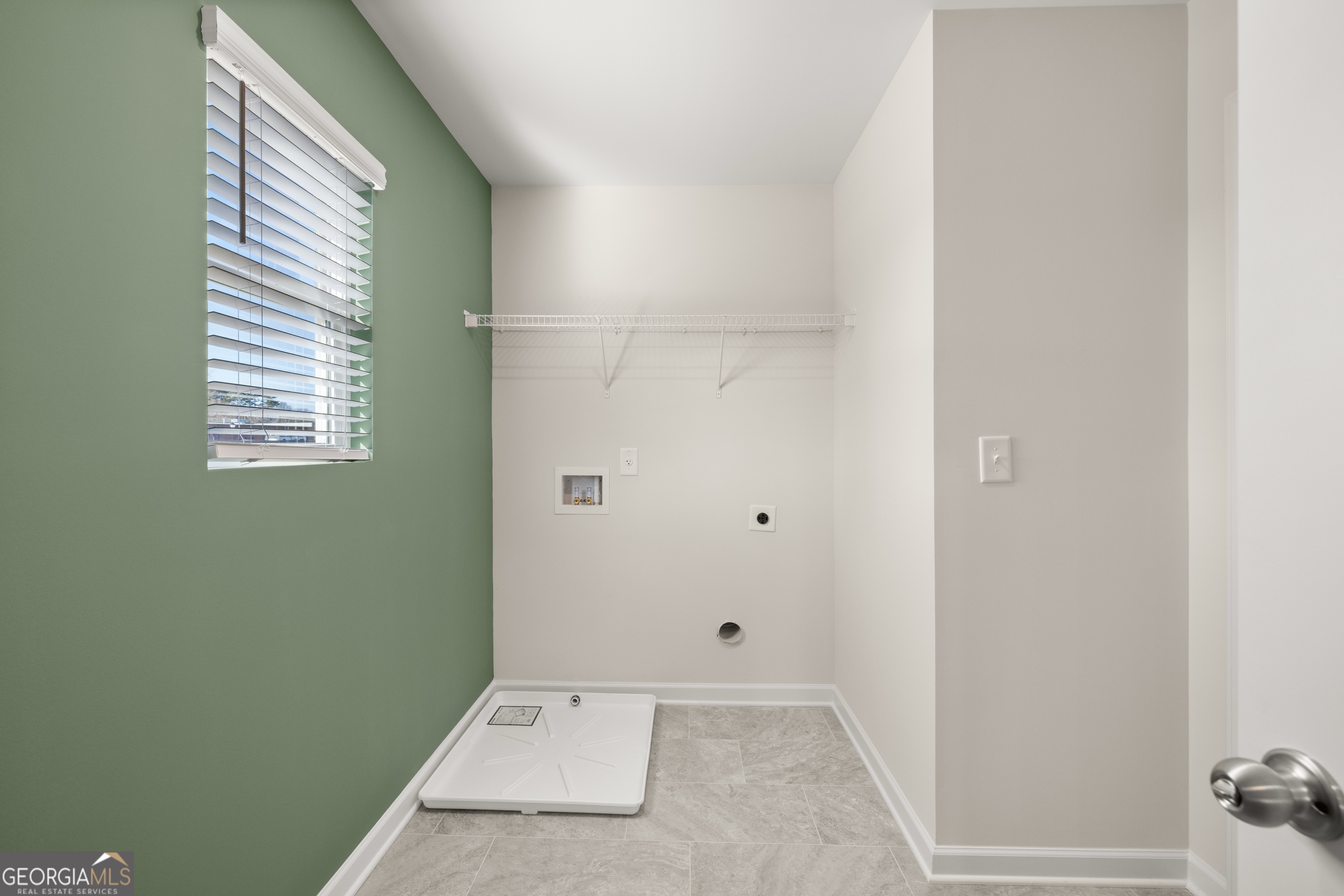 3261 Lake Carlton Road, Unit 24 Loganville, GA 30052 - Photo 32 of 33 a view of an empty room with a window