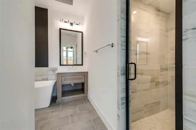 a bathroom with a bathtub and a sink