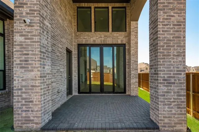 a view of a house with a yard and porch