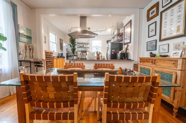 a living room with lots of furniture and a chandelier