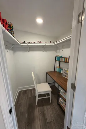 a view of a room with racks on the wall