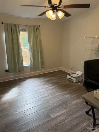 a view of room with window and ceiling fan