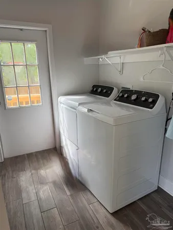 a utility room with closet dryer and washer