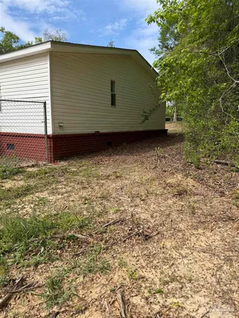 a view of house with backyard