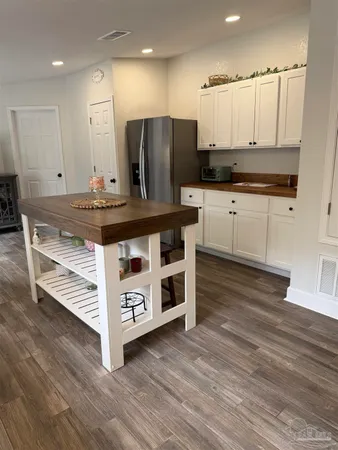 a kitchen with stainless steel appliances a stove a sink and a refrigerator