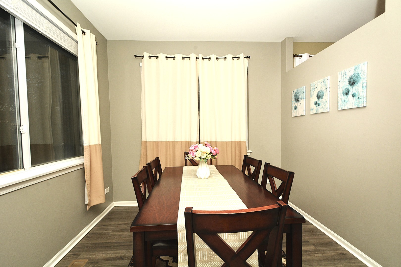 2974 Waters Edge Circle Aurora, IL 60504 - Photo 4 of 13 a view of a dining room with furniture window and wooden floor