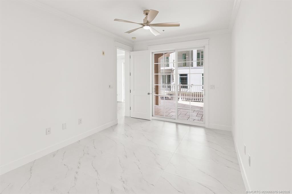 47 Southwest Osceola Street, Unit UN206 Stuart, FL 34994 - Photo 12 of 43 an empty room with a empty space and windows