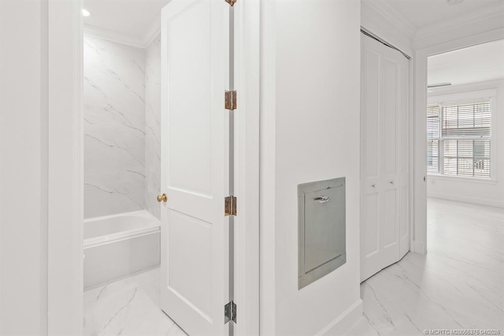 47 Southwest Osceola Street, Unit UN206 Stuart, FL 34994 - Photo 14 of 43 a bathroom with a bathtub