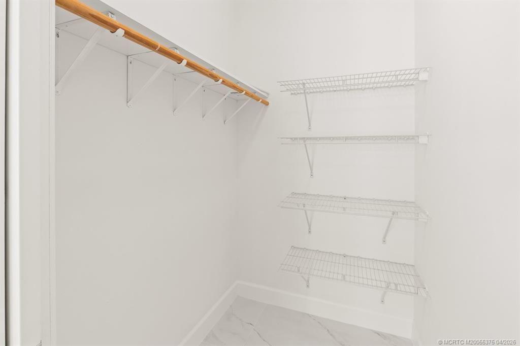 47 Southwest Osceola Street, Unit UN206 Stuart, FL 34994 - Photo 16 of 43 a view of an empty walk in closet
