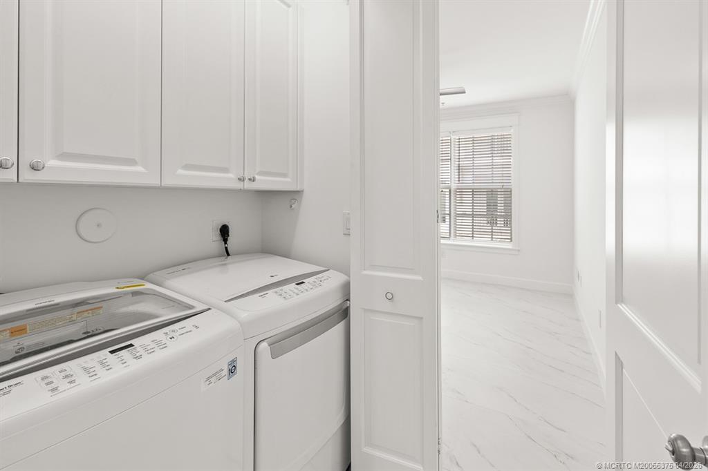 47 Southwest Osceola Street, Unit UN206 Stuart, FL 34994 - Photo 18 of 43 a utility room with dryer and washer