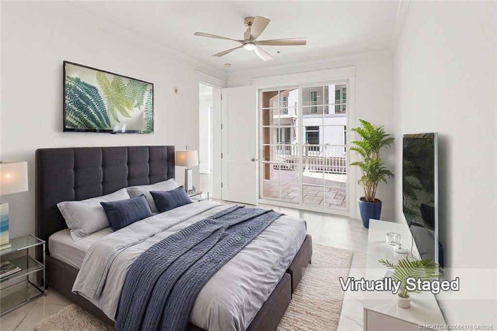 47 Southwest Osceola Street, Unit UN206 Stuart, FL 34994 - Photo 2 of 43 a bedroom with bed and a couch