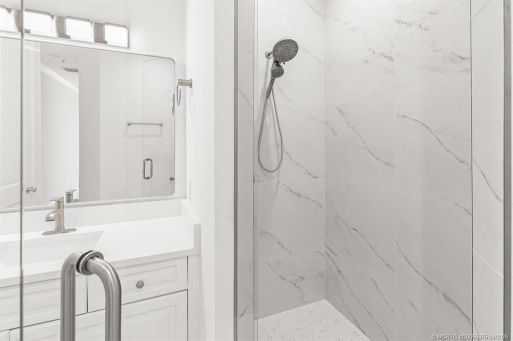 47 Southwest Osceola Street, Unit UN206 Stuart, FL 34994 - Photo 21 of 43 a bathroom with a shower