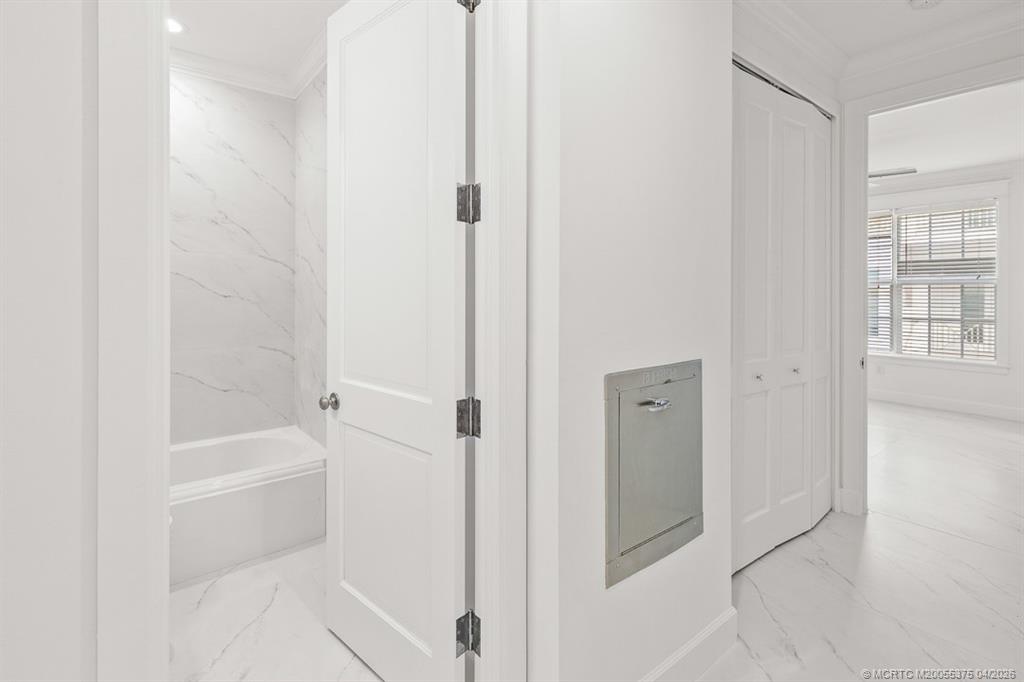 47 Southwest Osceola Street, Unit UN206 Stuart, FL 34994 - Photo 23 of 43 a bathroom with a bathtub
