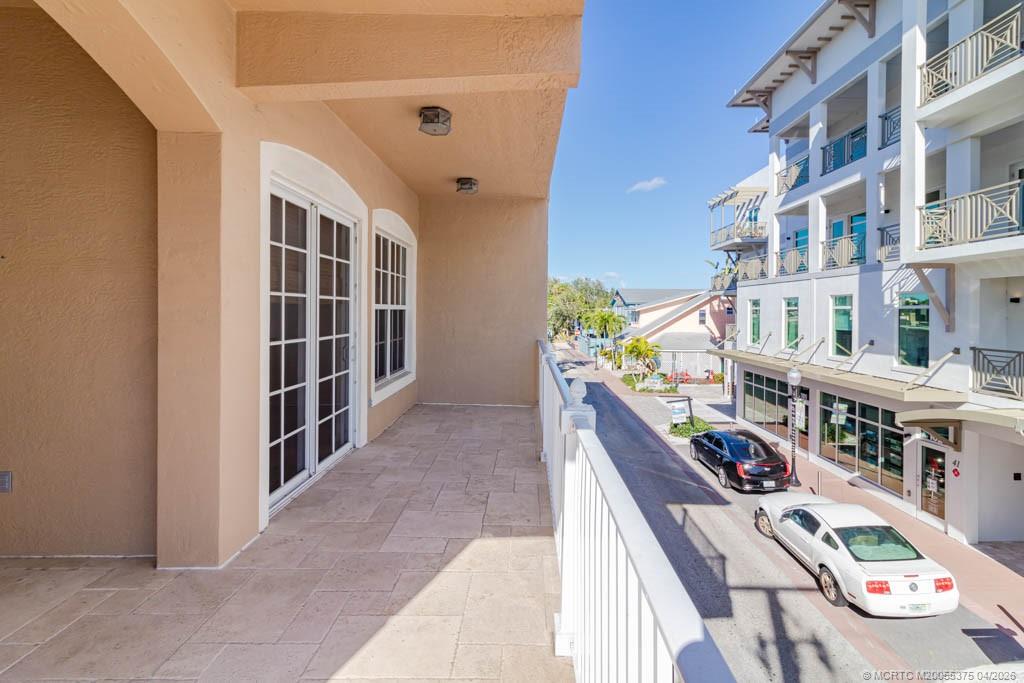 47 Southwest Osceola Street, Unit UN206 Stuart, FL 34994 - Photo 26 of 43 a view of an buildings with entryway and stairs