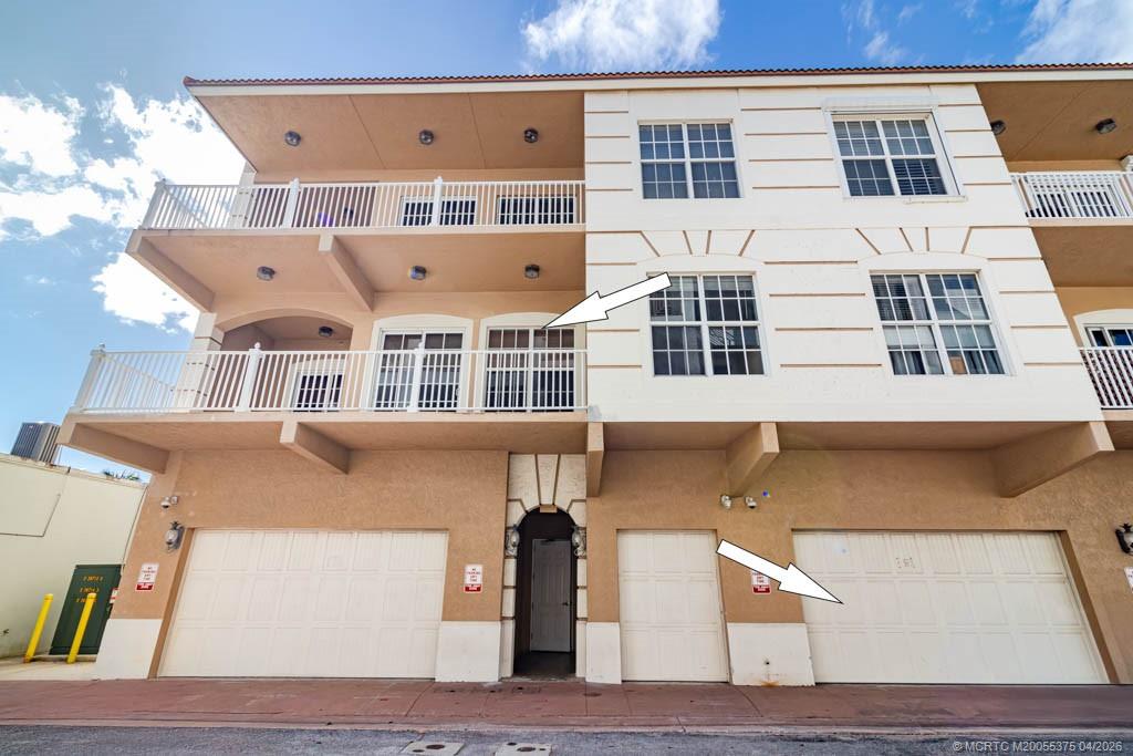 47 Southwest Osceola Street, Unit UN206 Stuart, FL 34994 - Photo 34 of 43 a view of building with large windows