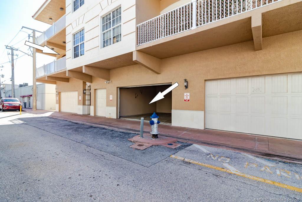 47 Southwest Osceola Street, Unit UN206 Stuart, FL 34994 - Photo 35 of 43 a house view with a street