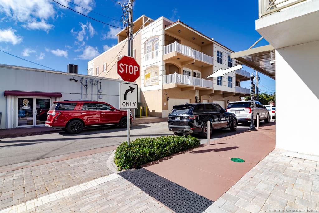 47 Southwest Osceola Street, Unit UN206 Stuart, FL 34994 - Photo 36 of 43 a view of a street with cars