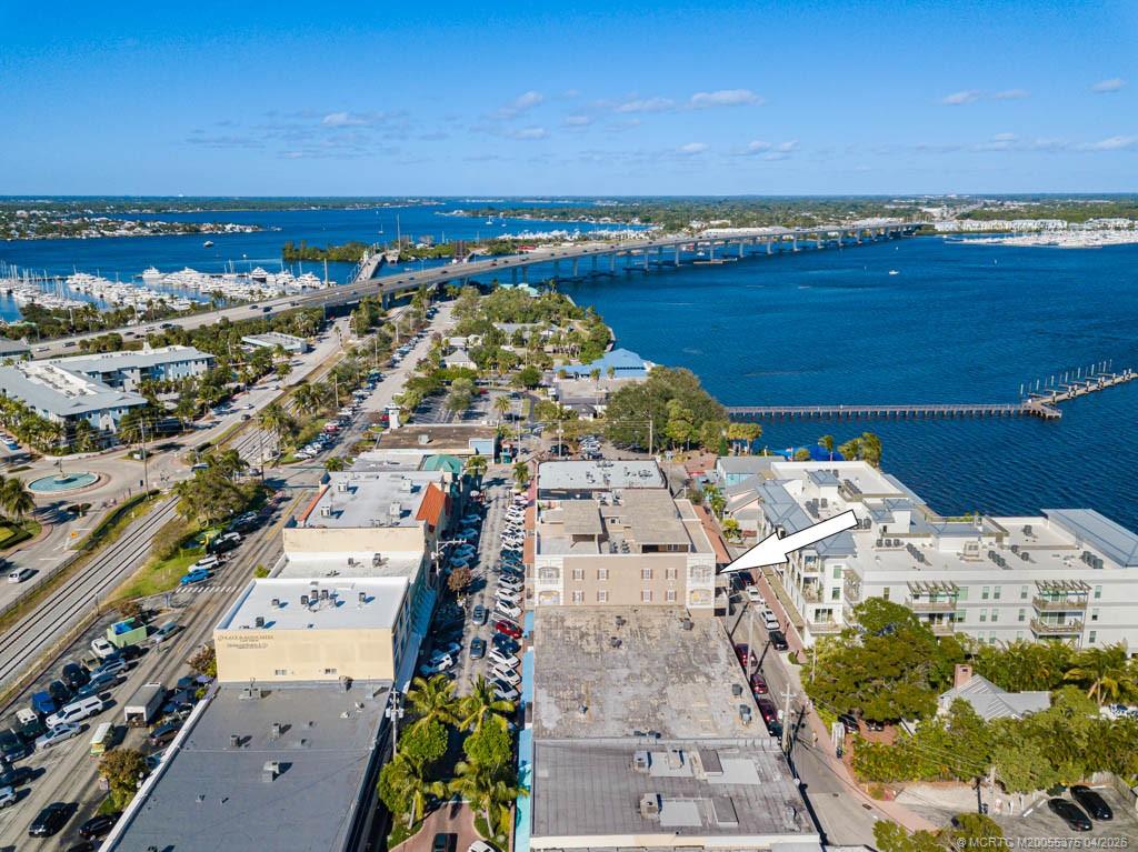 47 Southwest Osceola Street, Unit UN206 Stuart, FL 34994 - Photo 41 of 43 an aerial view of residential houses with outdoor space