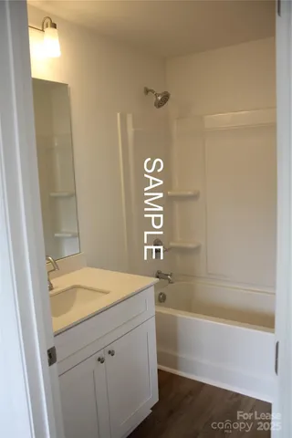 a bathroom with a bathtub and a sink
