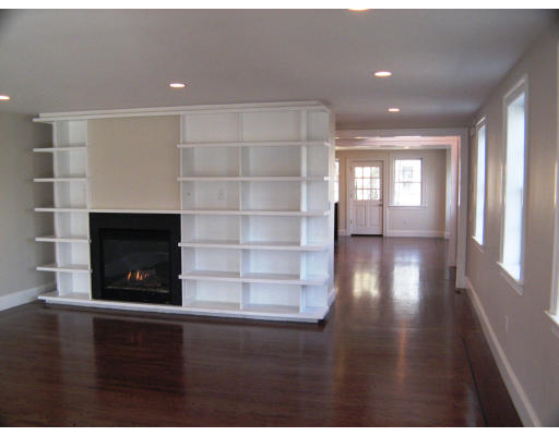 19 Roberts Road, Unit 19 Cambridge, MA 02138 - Photo 4 of 5 a view of an empty room with wooden floor and a window