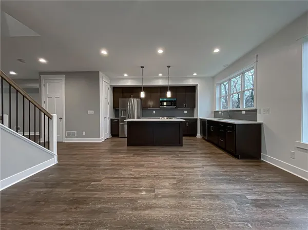 a view of kitchen and kitchen with a sink
