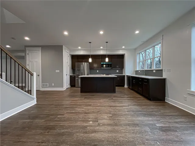 a view of kitchen and kitchen with a sink