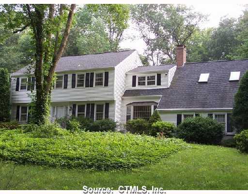 11 Colonial Road Madison, CT 06443 - Photo 1 of 1 a front view of a house with a yard