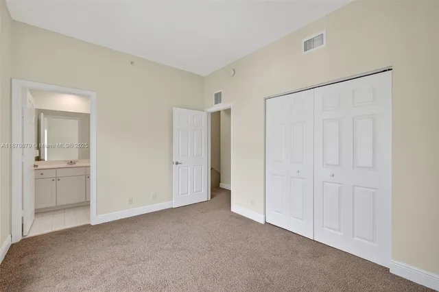 a front view of a house with garden and parking