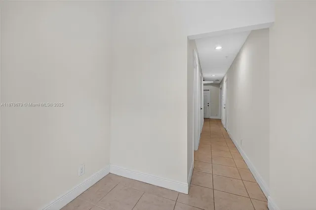 a front view of multiple houses with yard