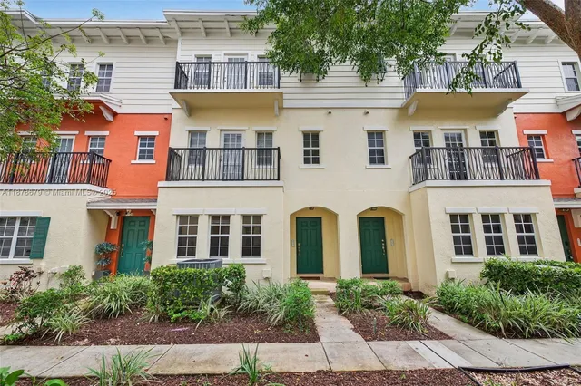 an aerial view of residential building with lake view