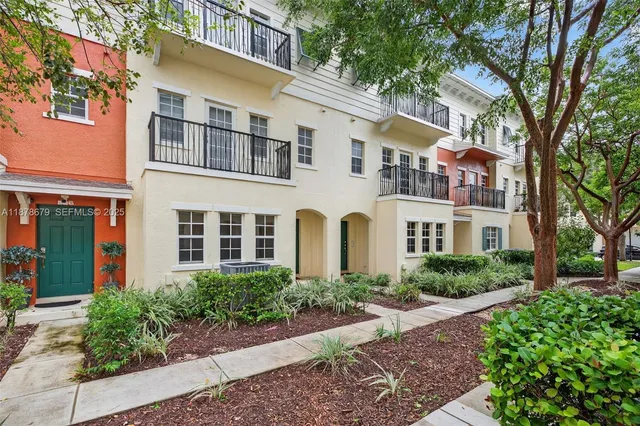 an aerial view of residential building with lake view