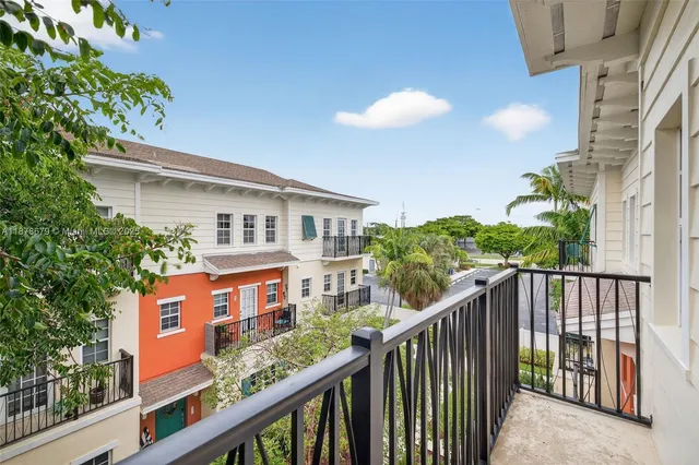 an aerial view of a house with swimming pool patio and outdoor seating
