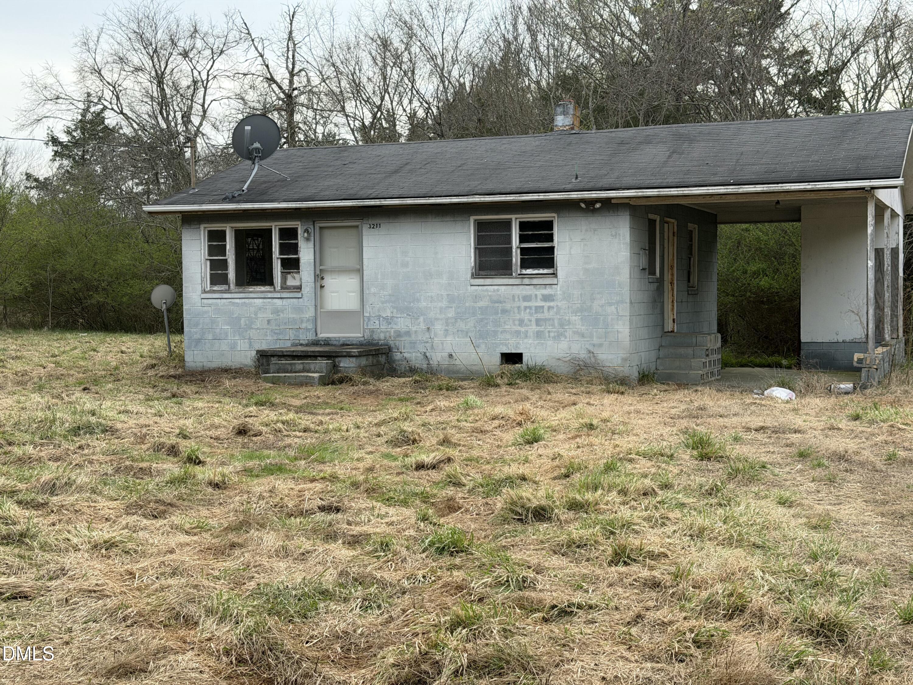 A57-57 Edwin Robertson Road Roxboro, NC 27574 - Photo 4 of 5 a view of a house with a yard