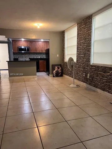 a lobby with furniture and a fireplace