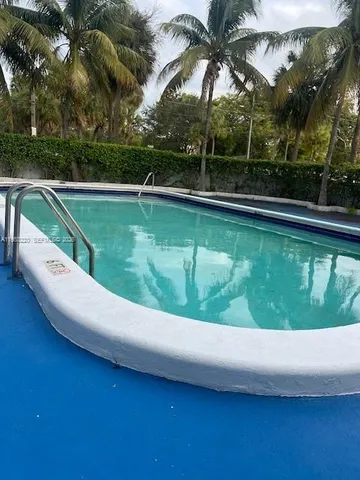 a view of a swimming pool with a garden