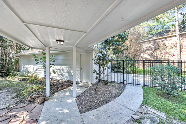 a view of a porch with a garden