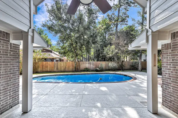 a view of swimming pool with patio