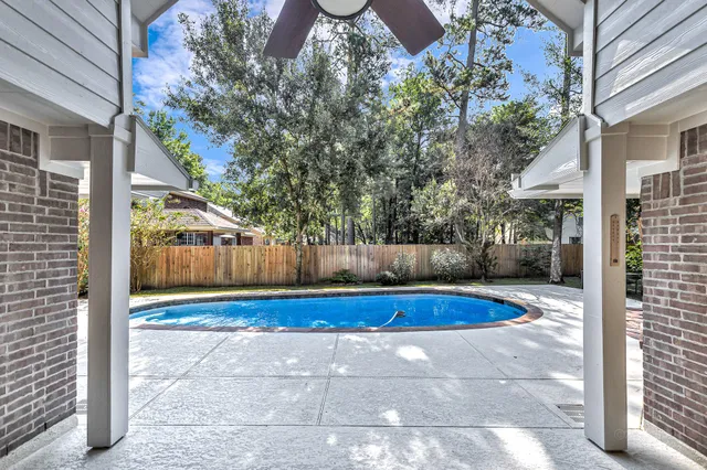 a view of swimming pool with patio