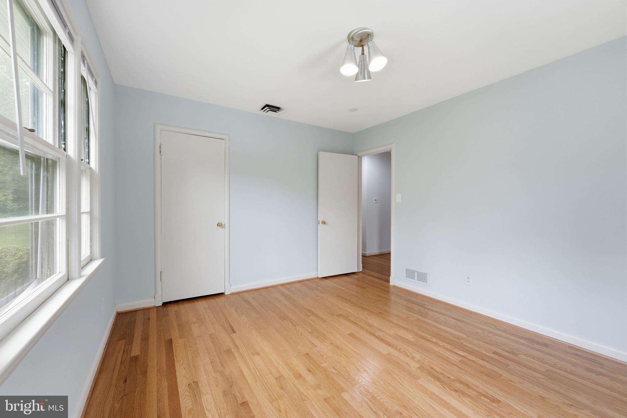 228 Northwest Terrace Silver Spring, MD 20901 - Photo 33 of 70 a view of empty room with wooden floor and fan