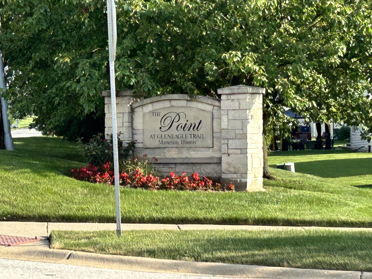 21211 Gray Hawk Drive Matteson, IL 60443 - Photo 2 of 36 a sign on the side of the road