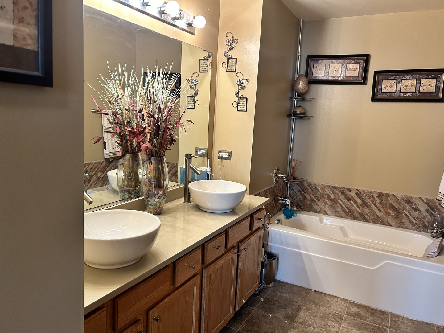 21211 Gray Hawk Drive Matteson, IL 60443 - Photo 32 of 36 a bathroom with a double vanity sink and a mirror